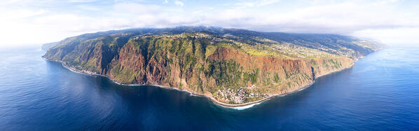 Aerial panoramic of Jardim do Mar tourist town on rocky coastline by the ocean, Madeira island, Portugal