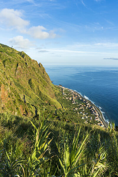 Coastal village of Paul Do Mar  view from the green landscape on the above mountains, Calheta, Madeira island, Portugal