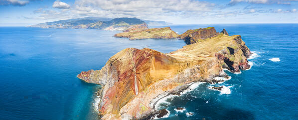 Aerial view of volcanic rock cliffs overlooking the blue ocean, Sao Lourenco Peninsula, Canical, Madeira island, Portugal
