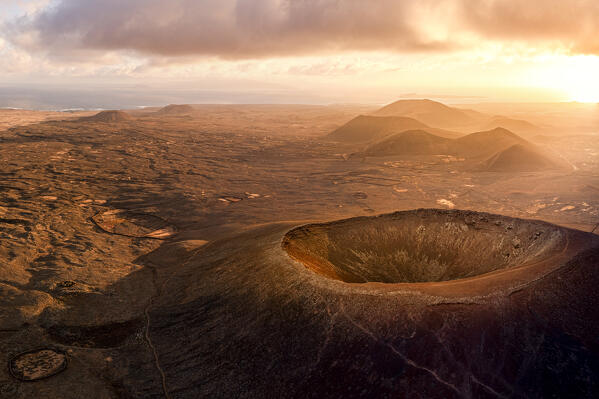 Aerial panoramic of Calderon Hondo volcanic crater at sunrise, Corralejo, Fuerteventura, Canary Islands, Spain