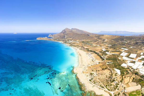 Aerial panoramic of mountains and crystal sea surrounding Falassarna beach, Kissamos, Chania, Crete, Greece
