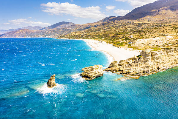 Aerial view of cliffs and Triopetra beach washed by the crystal turquoise sea, Plakias, Crete island, Greece