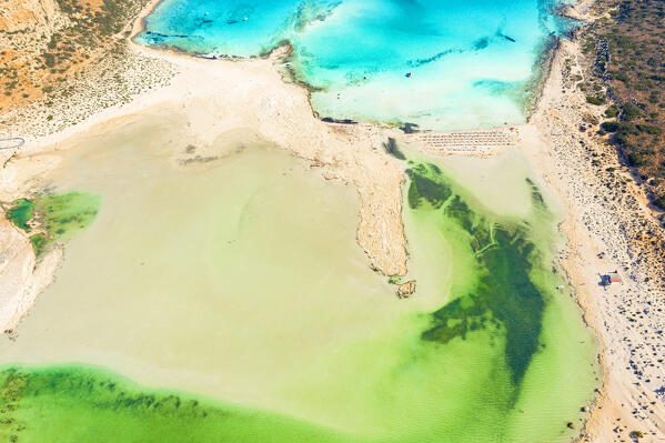Aerial view of shallow emerald green water of Balos lagoon and crystal sea, Crete island, Greece