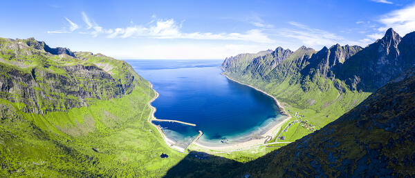 Aerial view of idyllic sand beach framed by mountains covered with grass in summer, Ersfjord, Senja, Troms county, Norway