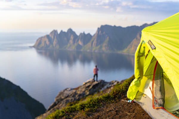 Camping tent of hiker on mountain top, Senja island, Troms county, Norway