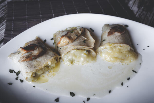 Crepes made of traditional Taroz of Valtellina with porcini mushrooms, Lombardy, Italy