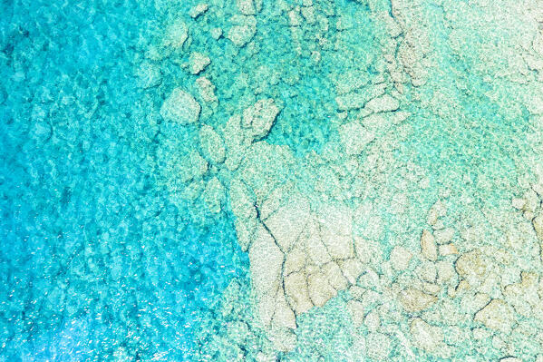 Rocks in the turquoise lagoon from above, aerial view, Crete island, Greece