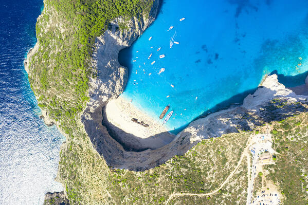 Turquoise lagoon surrounding the famous Shipwreck Beach (Navagio Beach) from above, aerial view, Zakynthos island, Greece