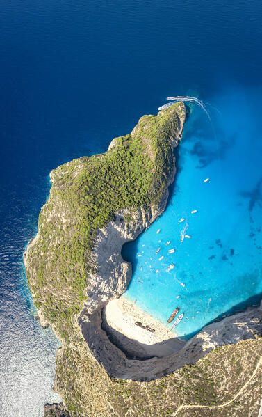 Turquoise lagoon surrounding the famous Shipwreck Beach (Navagio Beach) from above, aerial view, Zakynthos island, Greece