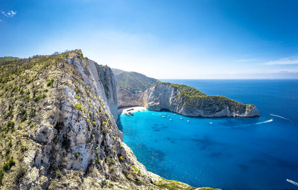 Majestic limestone cliffs surrounding the idyllic Navagio Beach (Shipwreck Beach), aerial view,  Zakynthos island, Greece