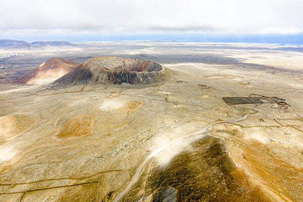 Aerial view of empty road crossing the volcanic landscape, Corralejo, Fuerteventura, Canary Islands, Spain