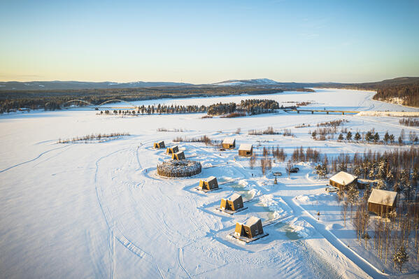 Aerial view of Scandinavian design of Arctic Bath Spa Hotel and cabins in the snowcapped landscape, Harads, Lapland, Sweden