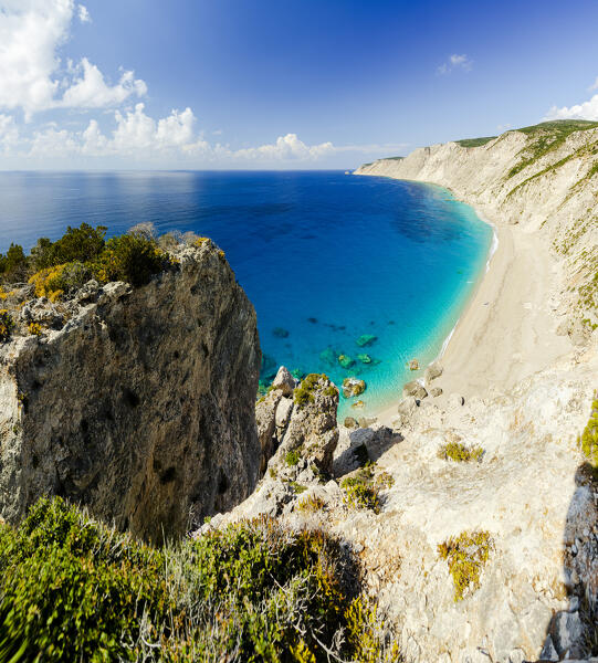Aerial panoramic view of the blue sea washing the fine sand of Ammos Beach, Kefalonia, Ionian Islands, Greece