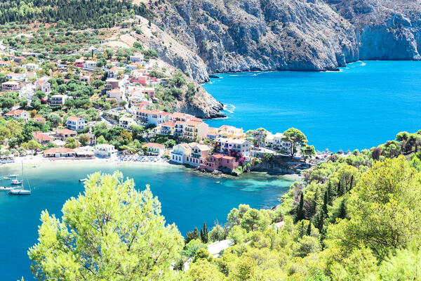 High angle view of colorful houses and beach in the coastal village of Assos, Kefalonia, Ionian Islands, Greece