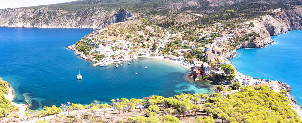 Scenic view of sand beach and harbor in the traditional Greek village of Assos, overhead view, Kefalonia, Ionian Islands, Greece