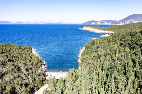 Aerial view of the scenic Dafnoudi Beach set among blue sea and cypress trees, Fiskardo, Kefalonia, Ionian Islands, Greece