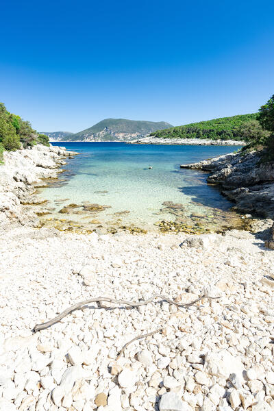 Clear summer sky over the white pebbles of Kimilia beach by the turquoise sea, Fiskardo, Kefalonia, Ionian Islands, Greece