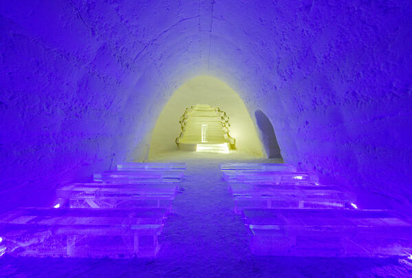 Surreal church interior of the ice hotel, Lainio Snow Village, Kittila, Lapland, Finland
