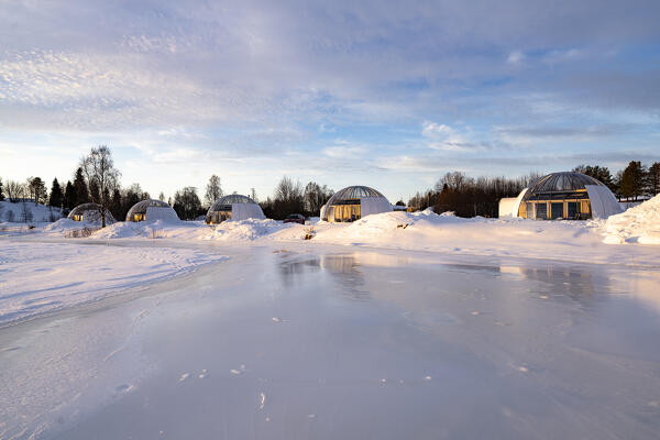 Igloo shaped cottages overlooking the frozen river in the cold arctic winter, Ice and Light village,
Kalix, Norrbotten county, Lapland, Sweden