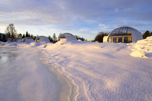 Glass igloo of a luxury tourist resort covered with snow on the banks of a frozen river, Ice and Light village,
Kalix, Norrbotten county, Lapland, Sweden