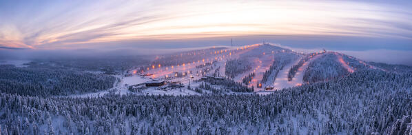 Aerial view of Ruka ski resort during the cold arctic sunset, Kuusamo, Northern Ostrobothnia, Lapland, Finland