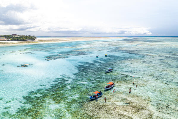 Aerial view of people enjoying a boat trip in the exotic lagoon, Pingwe, Michamvi, Zanzibar, Tanzania