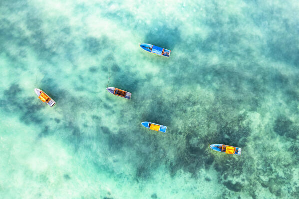 Fishing boats moored in the exotic lagoon, overhead view, Zanzibar, Tanzania