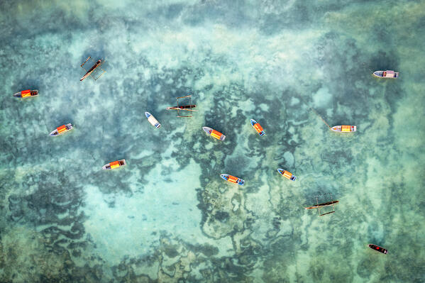 Boats moored in the crystal water of the Indian Ocean, aerial view, Zanzibar, Tanzania