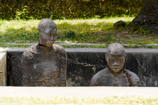 Statues representing the chained slaves of the past, Slave Museum, Stone Town, Zanzibar, Tanzania