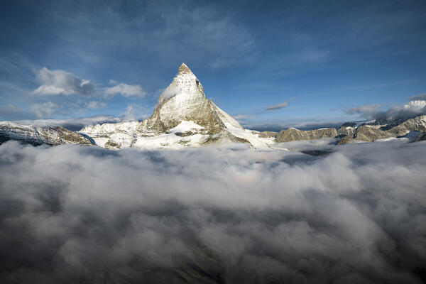 Majestic Matterhorn in autumn mist at sunrise, aerial view, Zermatt, canton of Valais, Switzerland