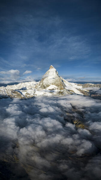 Sunrise over Matterhorn peak in autumn mist, aerial view, Zermatt, canton of Valais, Switzerland