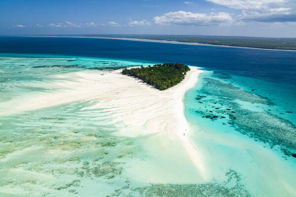 Aerial view of empty palm fringed beach on idyllic tropical island, Zanzibar, Tanzania