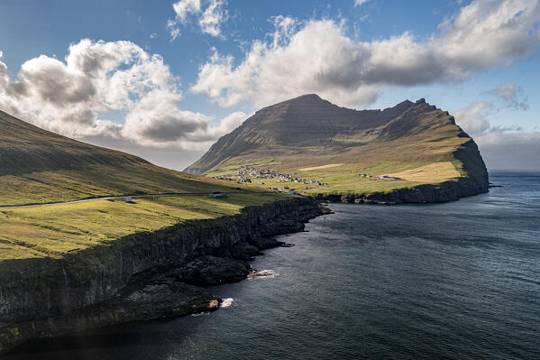 Aerial view of cliffs with Vidareidi village on background, Vidoy Island, Faroe Islands
