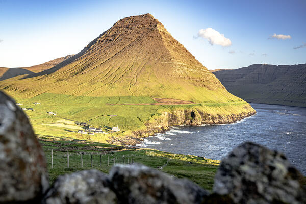 Sunlight ovet Vidareidi village and majestic Malinsfjall mountain, Vidoy Island, Faroe Islands