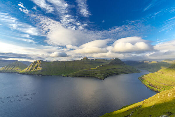 Bright summer sky over mountains and Funningur fjord, Eysturoy Island, Faroe Islands