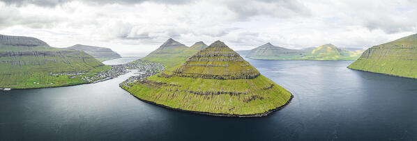 Aerial panoramic view of Klakkur mountain and cliffs along the fjord, Klaksvik,  Bordoy Island, Faroe Islands