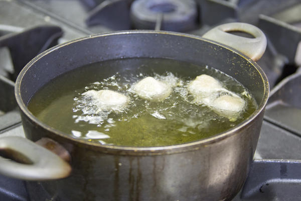 Sciatt being cooked in hot oil. Lombardy. Italy. Europe