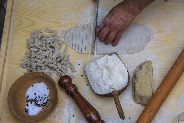 Cutting of the dough for the production of Pizzoccheri. Lombardy. Italy. Europe