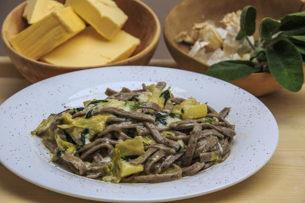 Dish of Pizzoccheri typical main course of Valtellina. Lombardy. Italy. Europe