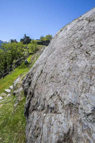The smooth Rupe Magna in front of the castle of Visconti Venosta in Grosio. Province of Sondrio. Valtellina. Lombardy. Italy. Europe