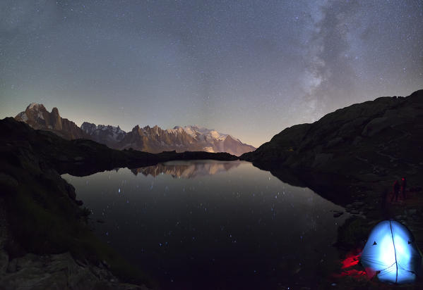 Camping under the stars at Lac du Cheserys. In the background the range of Mont Blanc. Haute Savoie. France