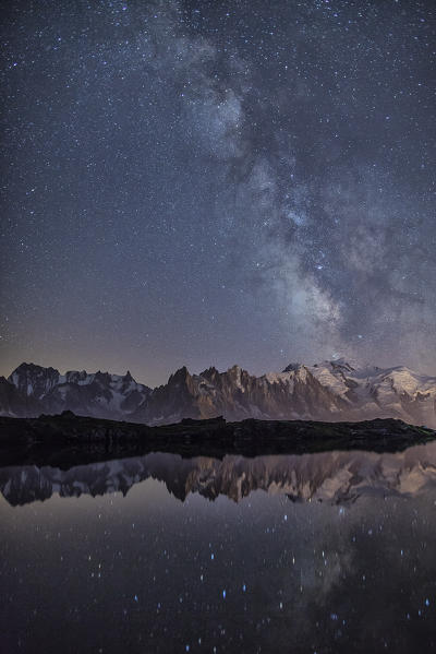 Starry sky over Mont Blanc range seen from Lac de Chesery. Haute Savoie. France