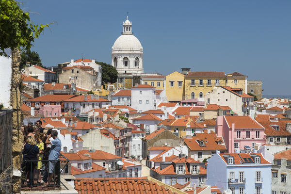 Terracotta roofs and the ancient dome seen from Miradouro Alfama one of the many viewpoints of Lisbon Portugal Europe