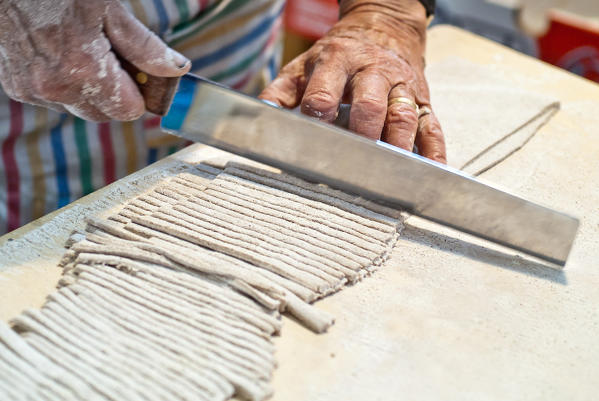 Preparing Pizzoccheri, typical dish from Valtellina, Lombardy Italy Europe
