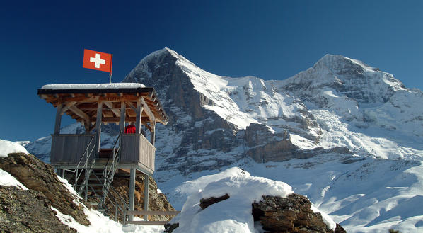 A lookout post by the Kleine-Scheidegg, right facing the impressive walls of the Eiger and the Monch, in the Bernese Alps in Switzerland Europe