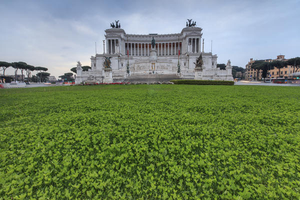 Dusk lights on the green gardens surrounding The Altare della Patria also known as Vittoriano Rome Lazio Italy Europe