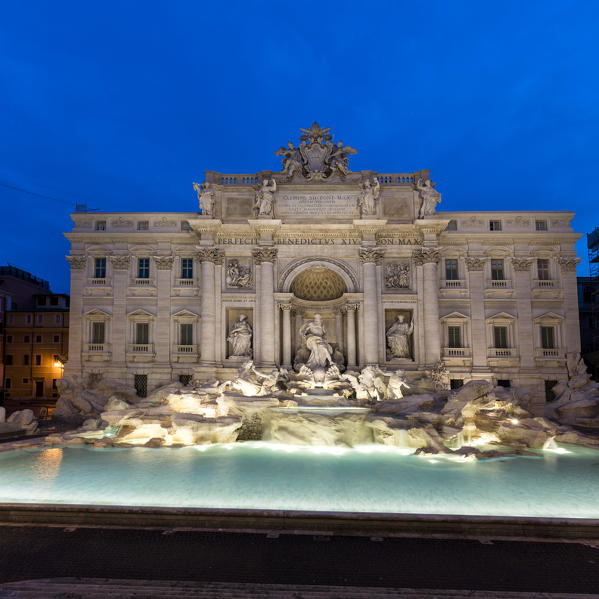 Panorama of Trevi Fountain illuminated by street lamps and the lights of dusk Rome Lazio Italy Europe