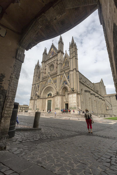 View of the gothic cathedral with golden mosaics and bronze doors Orvieto Terni Province Umbria Italy Europe