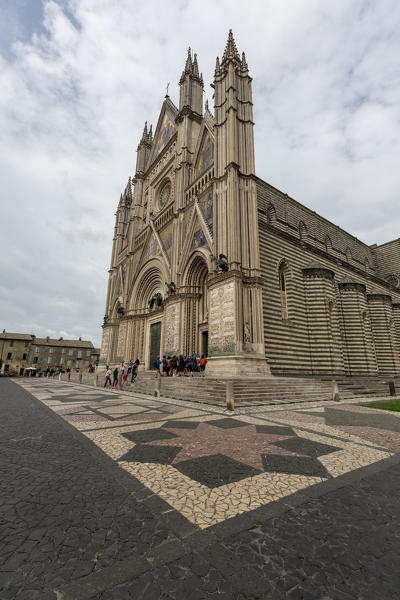 View of the gothic cathedral with golden mosaics and bronze doors Orvieto Terni Province Umbria Italy Europe