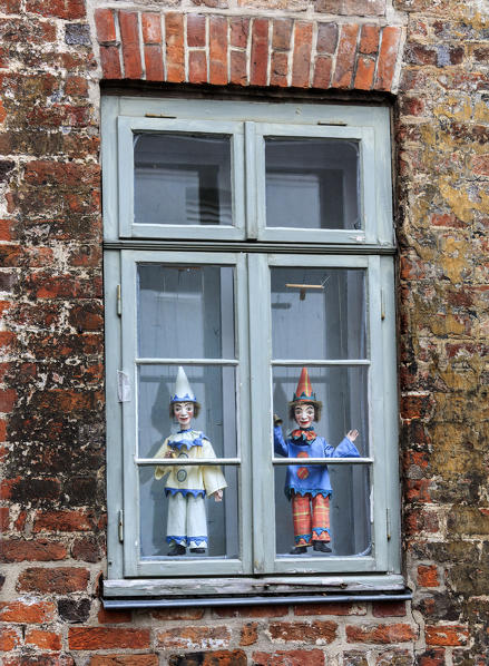 Window of a typical house of the gothic city center decorated with Marionette Lübeck Schleswig Holstein Germany Europe